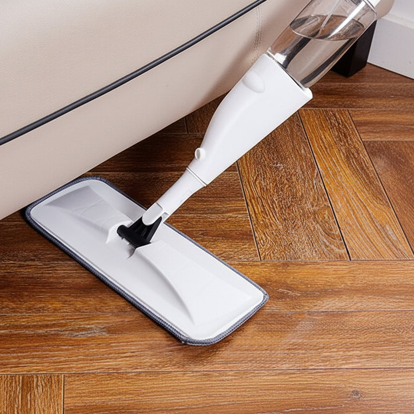 Mop cleaning a wooden floor with a close-up view