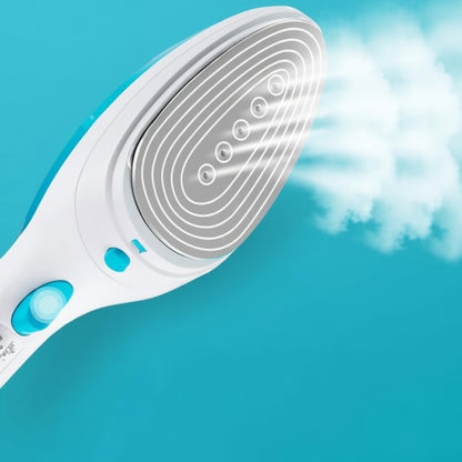 White handheld steamer emitting steam against a blue background
