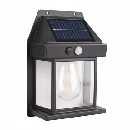 Solar-powered outdoor light fixture with a clear glass cover on a white background