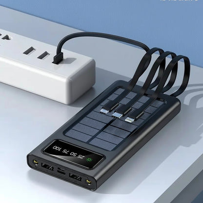 Black electronic device with solar panel and digital display on a light gray surface.